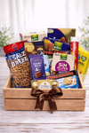 Gourmet snacks and chocolate gift crate with assorted treats in a wooden crate with ribbon