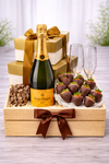 Champagne and chocolate celebration hamper with Veuve Clicquot, premium chocolates, champagne glasses and wooden gift crate