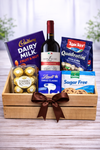 Gourmet gift crate with red wine, chocolates, Ferrero Rocher, cookies and wooden gift box with ribbon in the Philippines