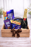 Moët & Chandon champagne with chocolates and gourmet cheese arranged in a wooden gift crate with ribbon